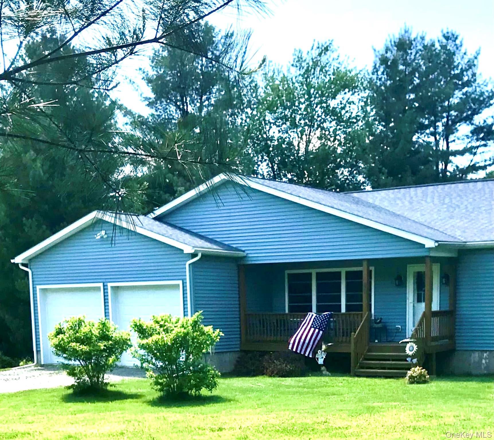 26 Valley Road Forestburgh, NY 12777 - Photo 1 of 33 a front view of house with yard and green space