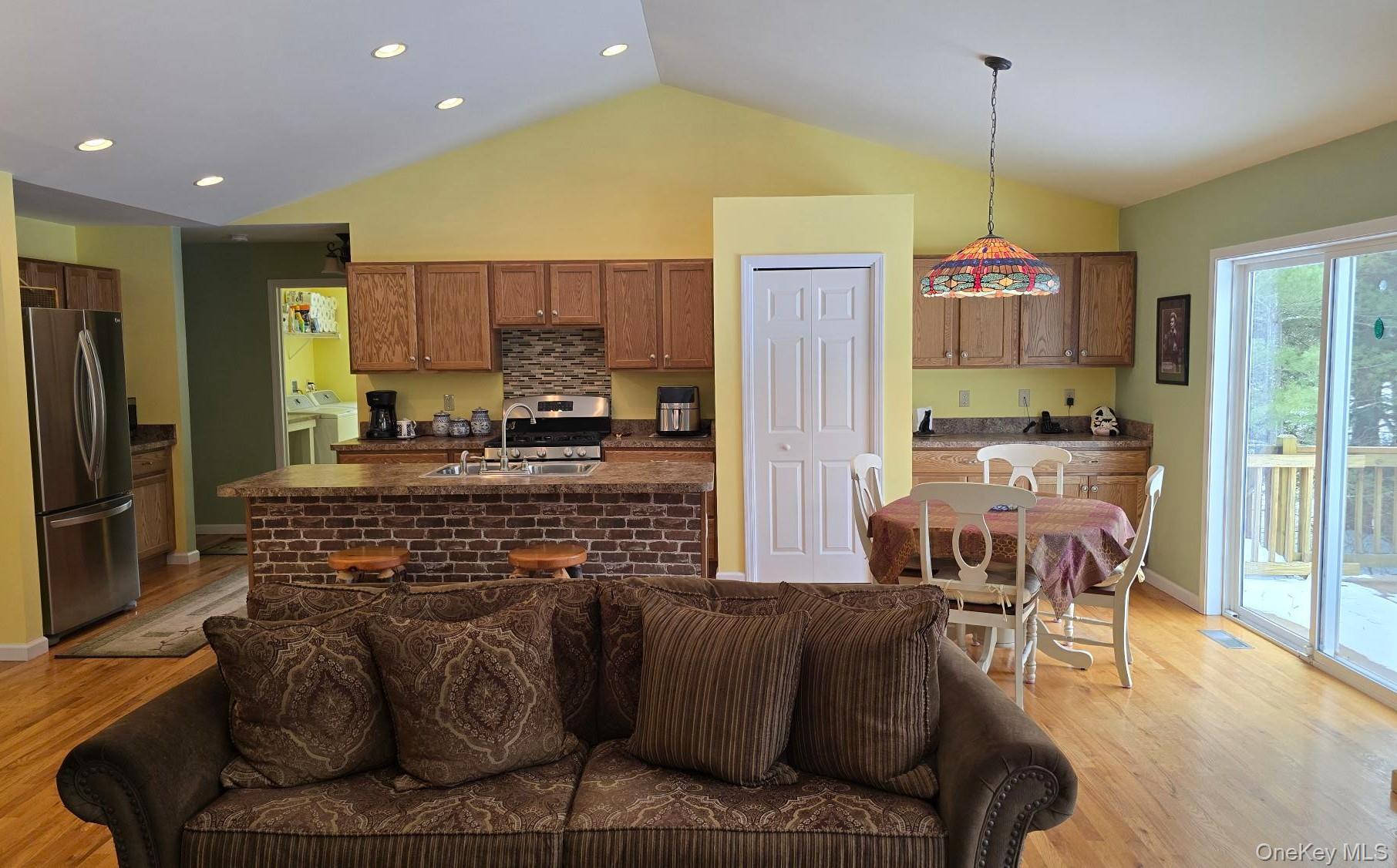 26 Valley Road Forestburgh, NY 12777 - Photo 14 of 33 a kitchen with stainless steel appliances kitchen island granite countertop a refrigerator and a stove