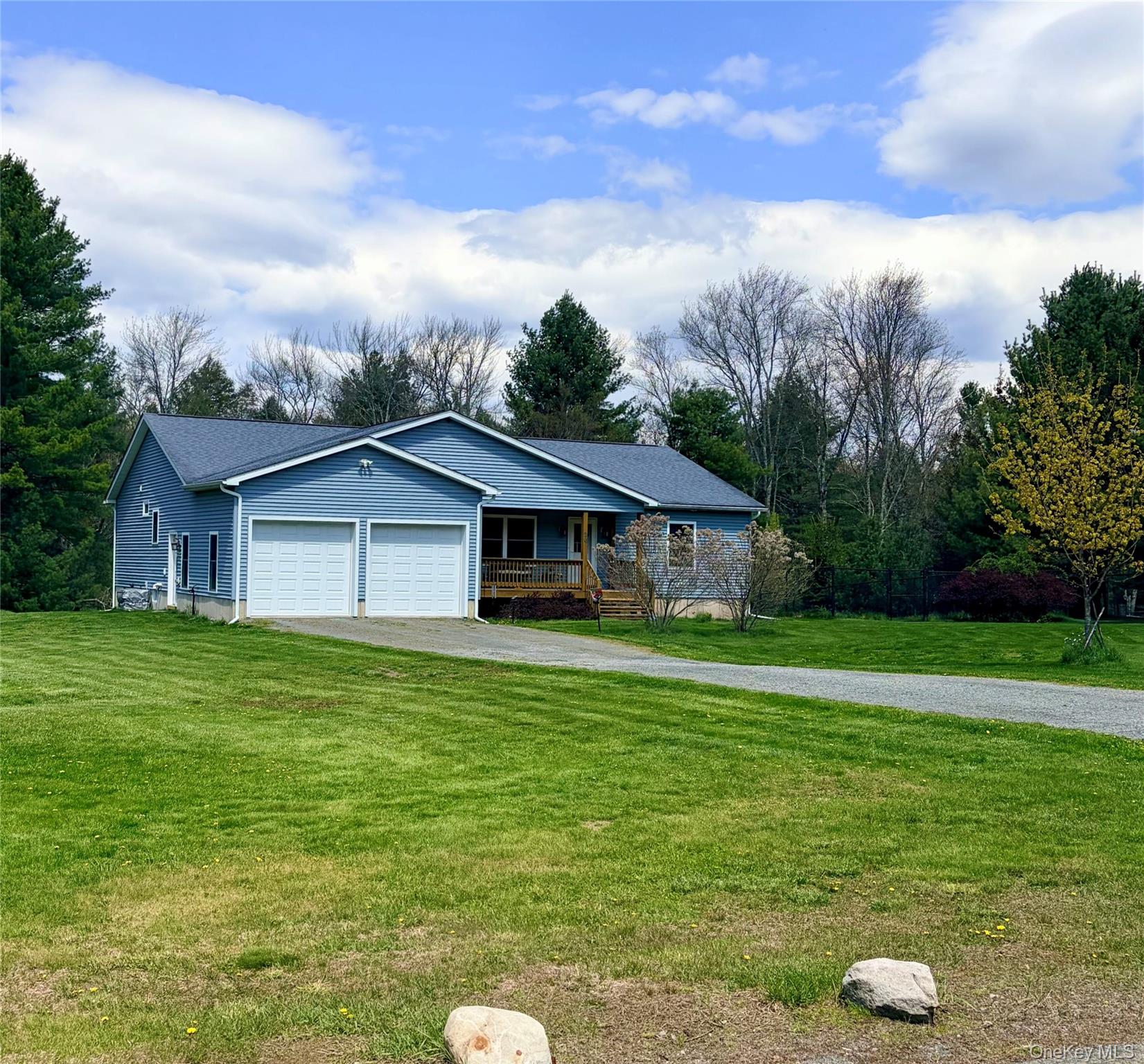 26 Valley Road Forestburgh, NY 12777 - Photo 2 of 32 a front view of a house with a garden