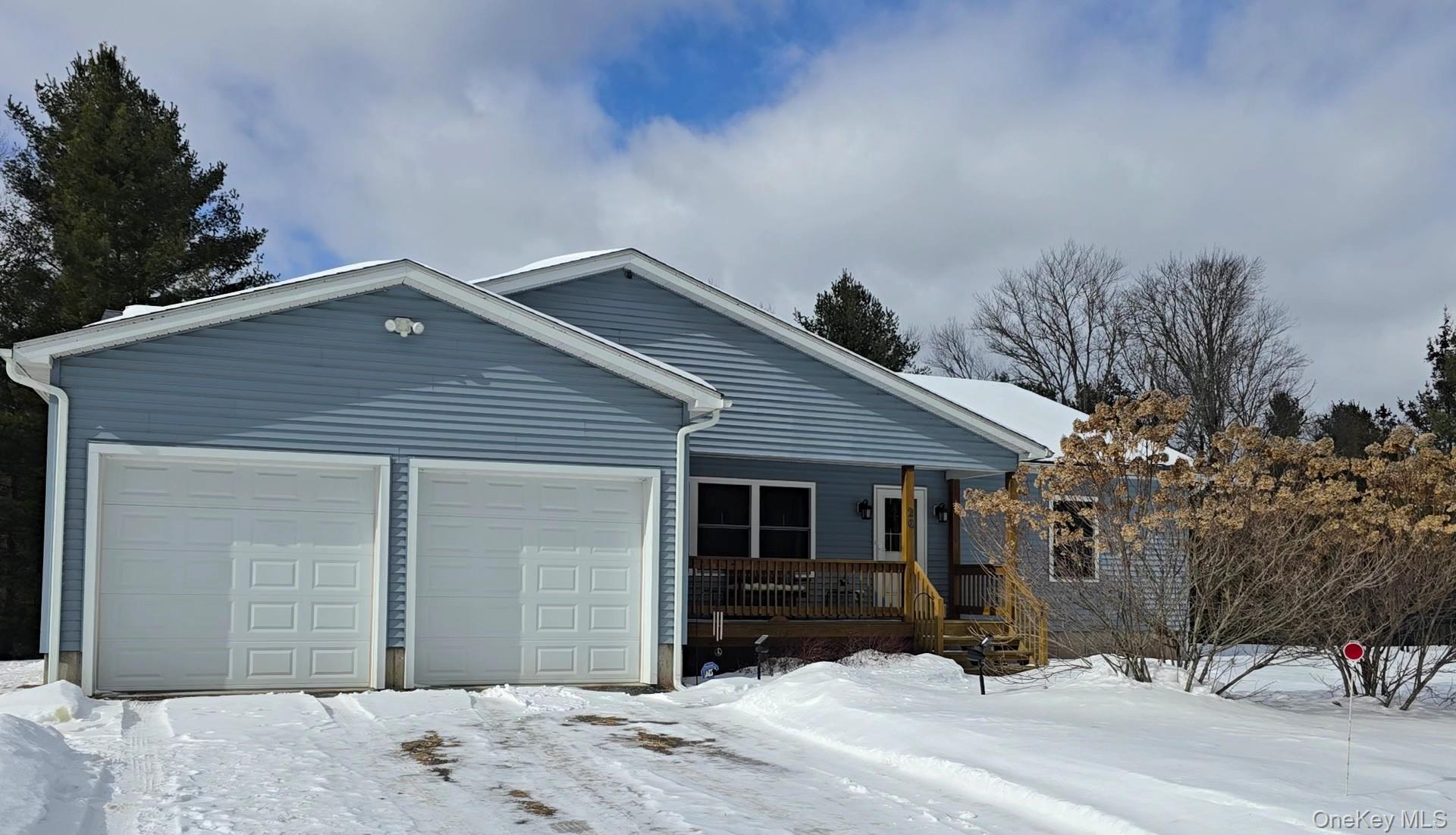 26 Valley Road Forestburgh, NY 12777 - Photo 2 of 33 a front view of a house with a yard and garage