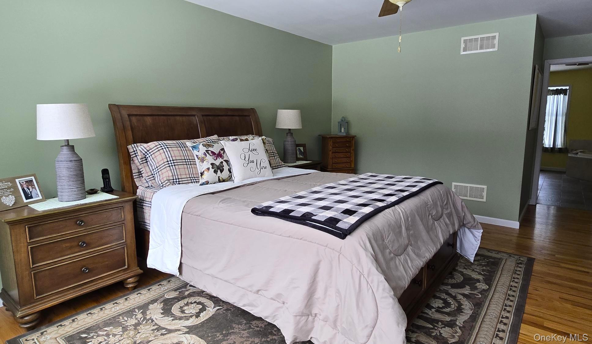 26 Valley Road Forestburgh, NY 12777 - Photo 24 of 32 a bedroom with a bed and wooden floor
