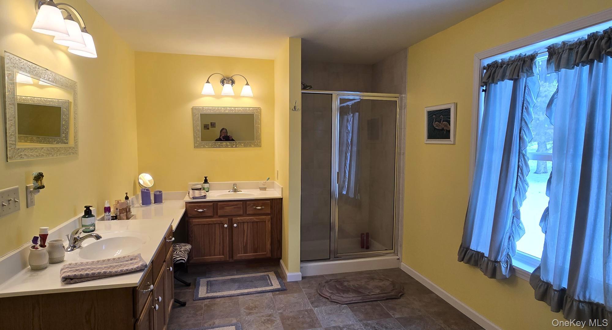 26 Valley Road Forestburgh, NY 12777 - Photo 26 of 33 a en suite bathroom with a sink and a mirror