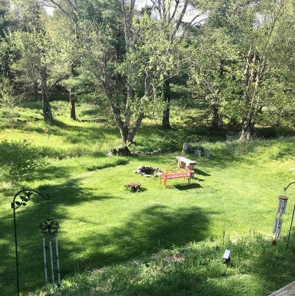 26 Valley Road Forestburgh, NY 12777 - Photo 7 of 33 a backyard of a house with swimming pool and green space