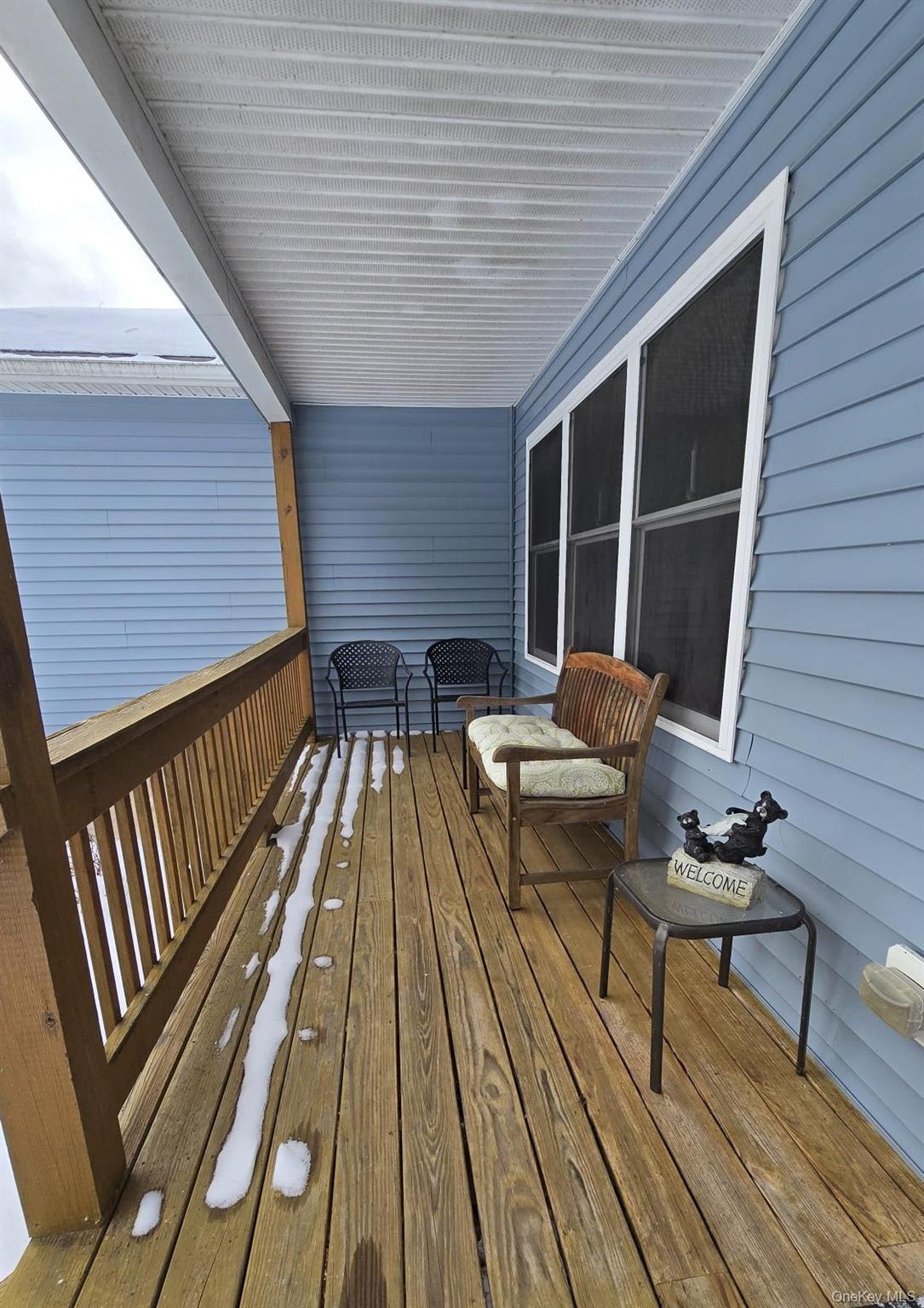 26 Valley Road Forestburgh, NY 12777 - Photo 9 of 32 a balcony with wooden floor and furniture