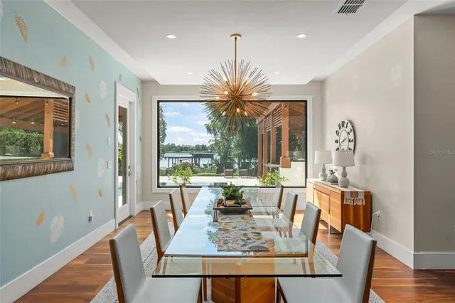 a spacious bedroom with a bed and a large window