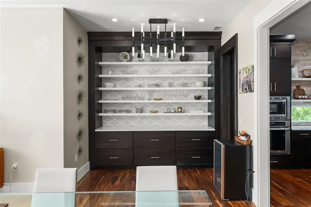 a bedroom with furniture and a flat screen tv