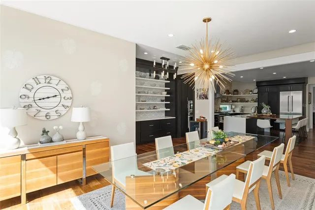 a spacious bedroom with a bed and a flat screen tv