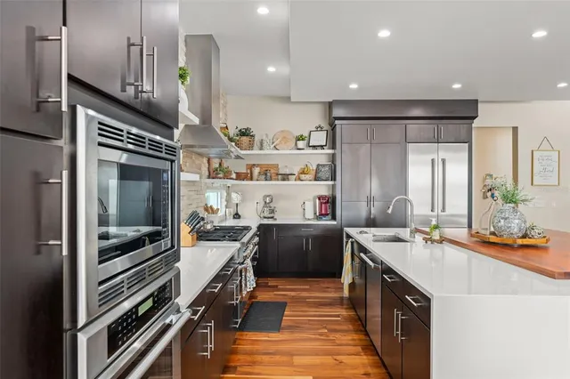 a spacious bathroom with a double vanity sink and a large mirror
