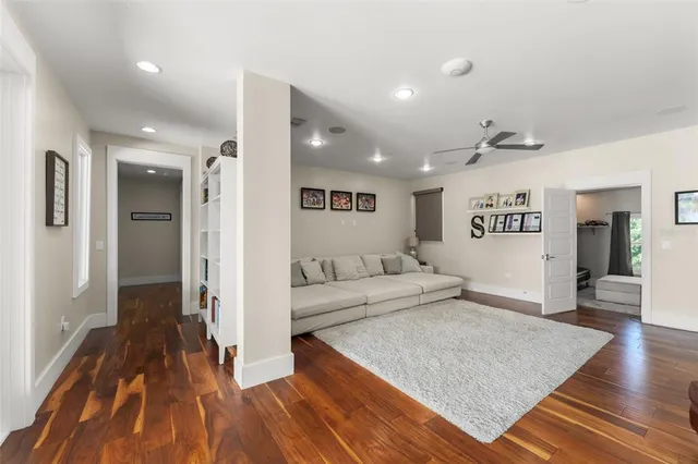 a spacious bedroom with a bed and a window