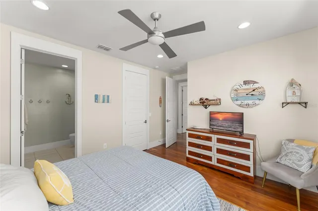 a view of a patio with a table and chairs and a barbeque