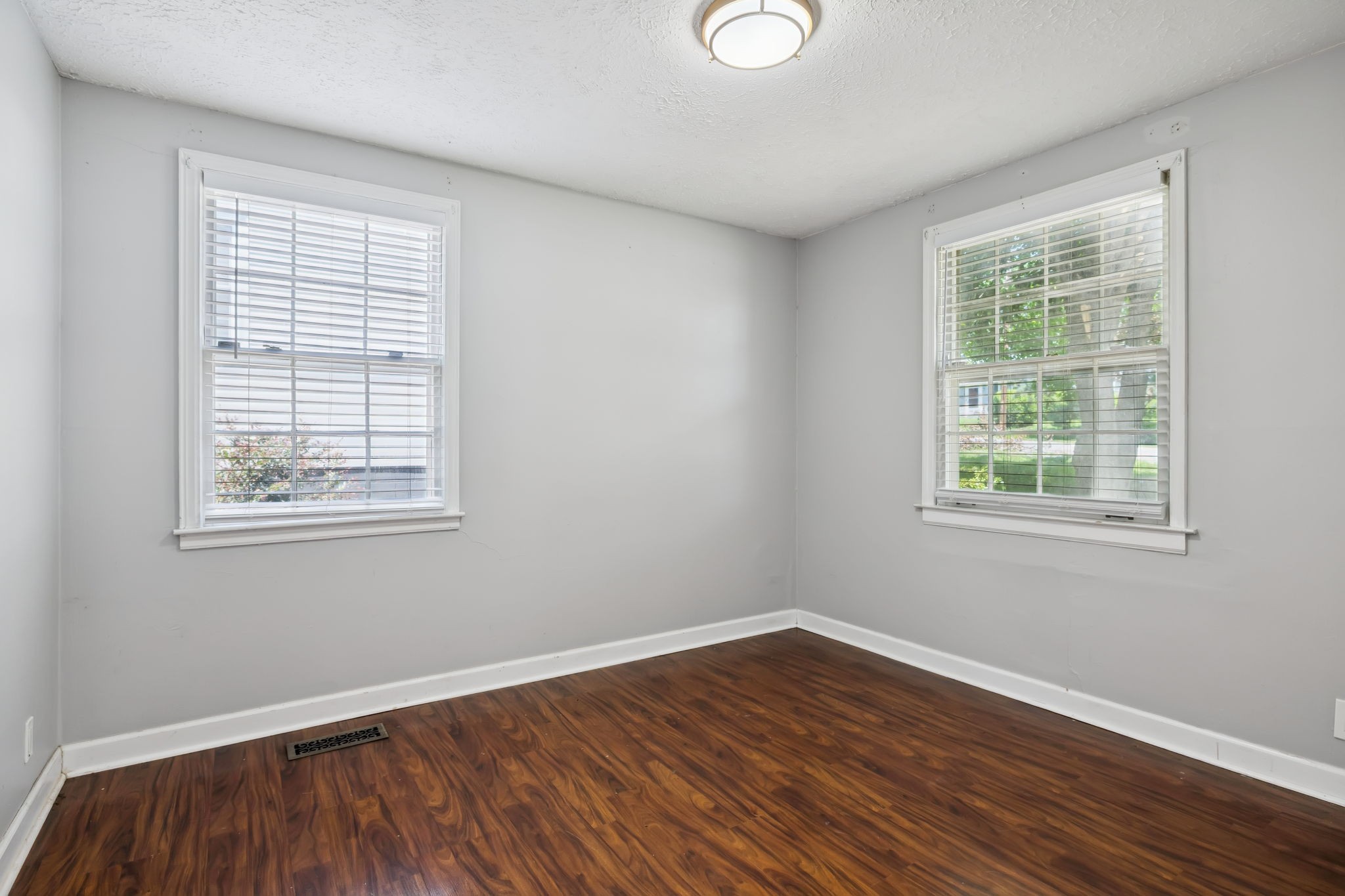 5415 Knob Road Nashville, TN 37209 - Photo 17 of 28 a view of an empty room with wooden floor and a window