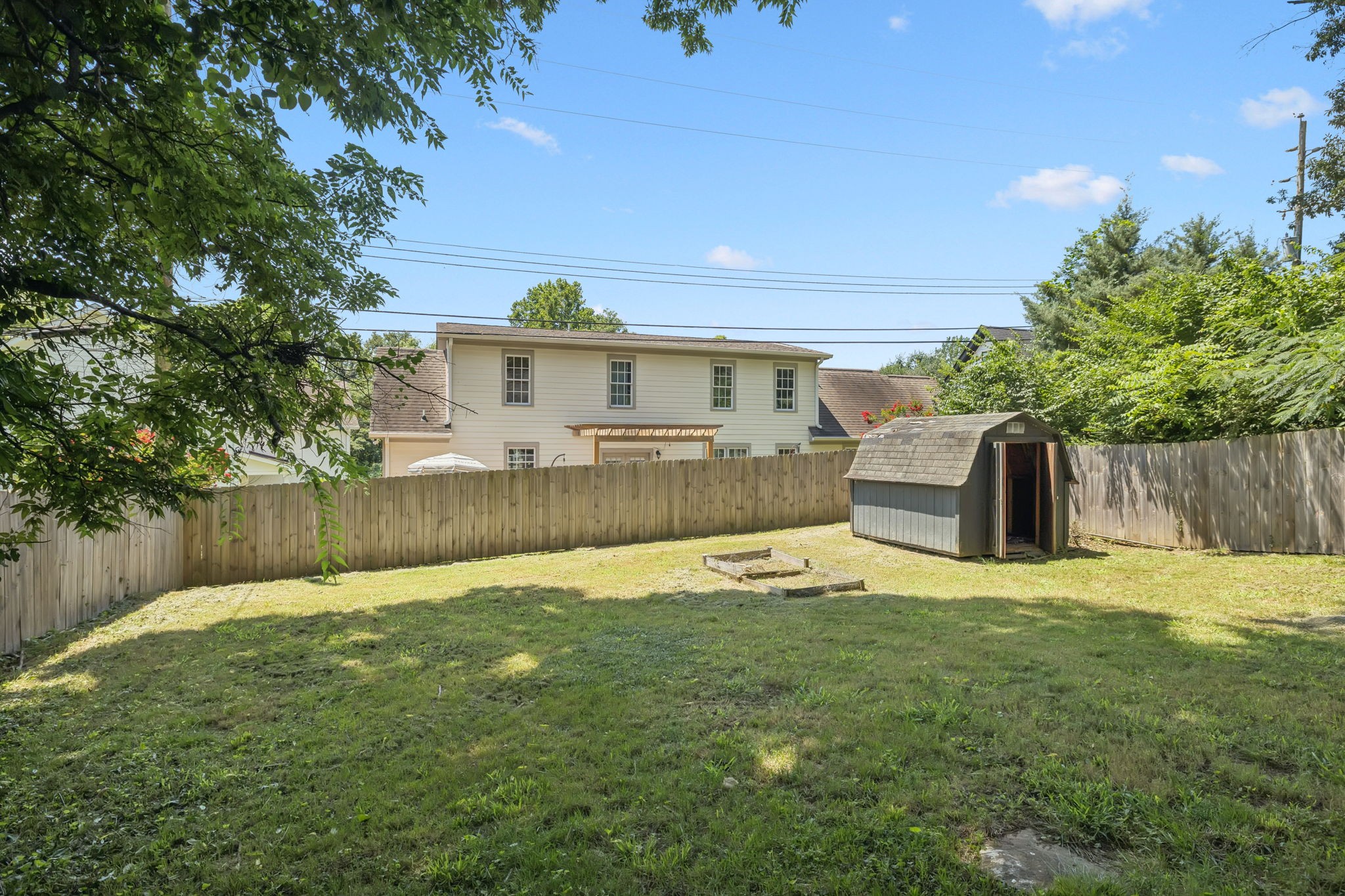 5415 Knob Road Nashville, TN 37209 - Photo 21 of 28 a view of a backyard with a garden and plants