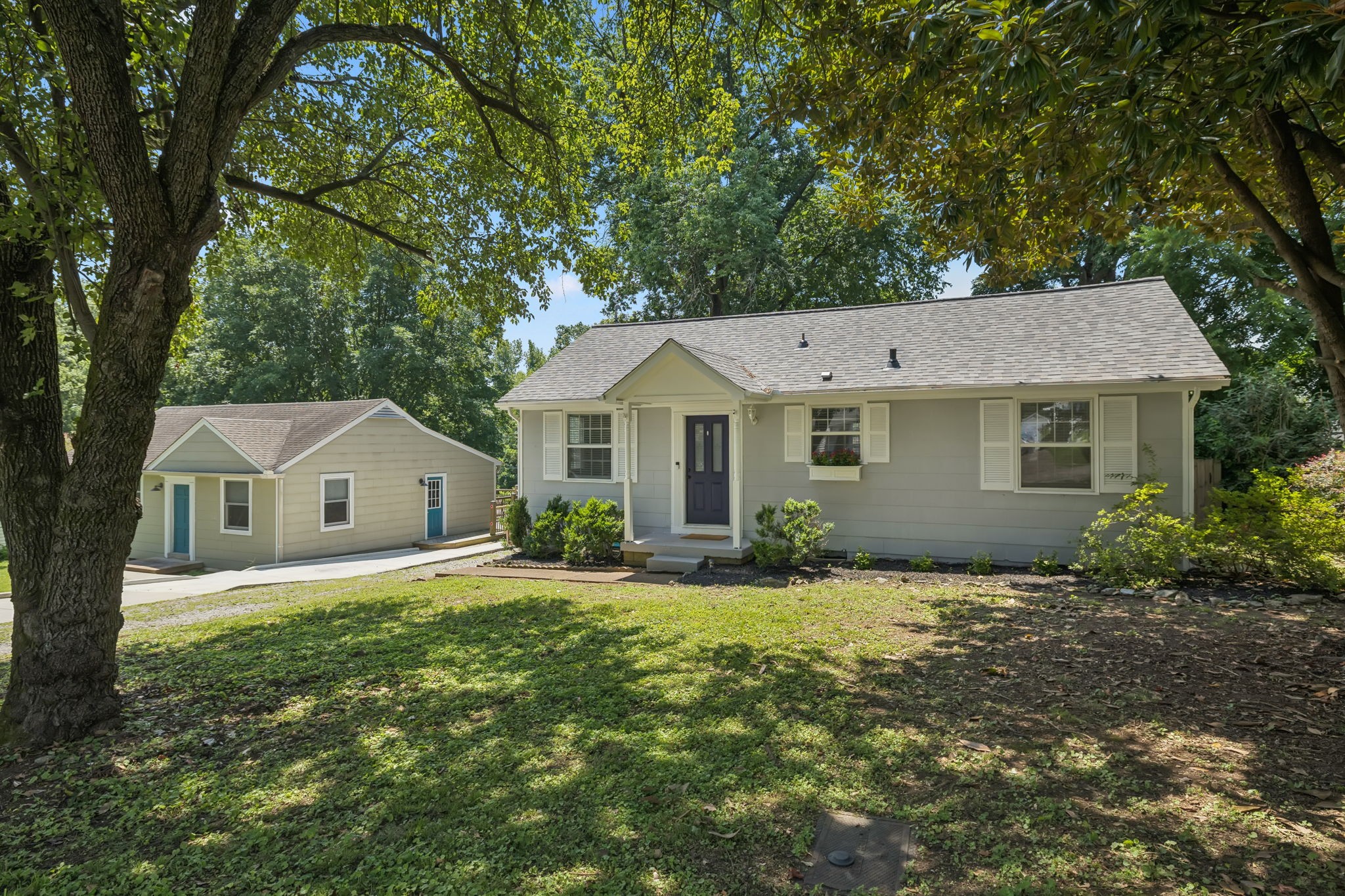 5415 Knob Road Nashville, TN 37209 - Photo 3 of 28 a view of a yard in front of a house with large tree