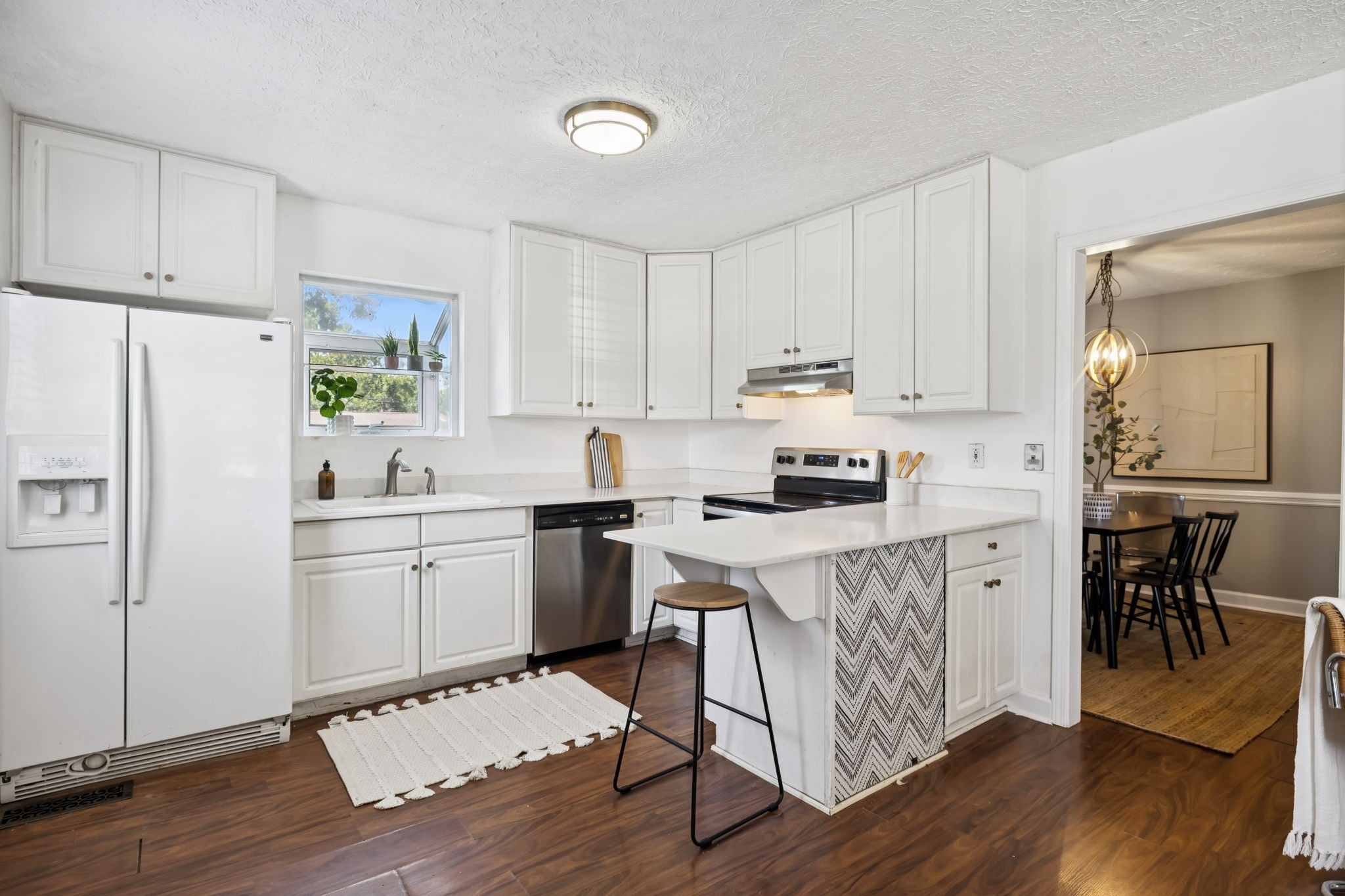 5415 Knob Road Nashville, TN 37209 - Photo 8 of 28 a kitchen with white cabinets and white appliances