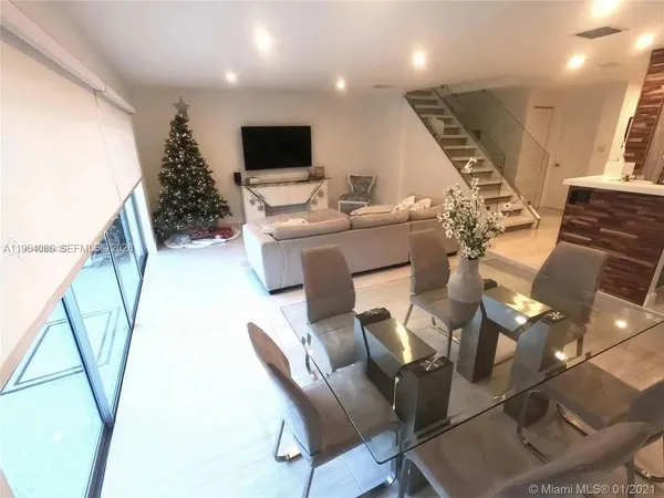 a kitchen with a sink and a refrigerator