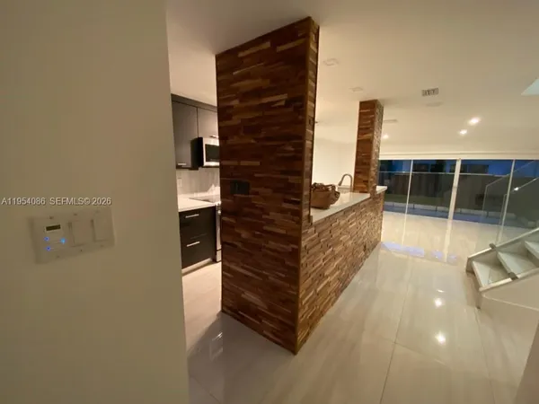 a view of a refrigerator in a house