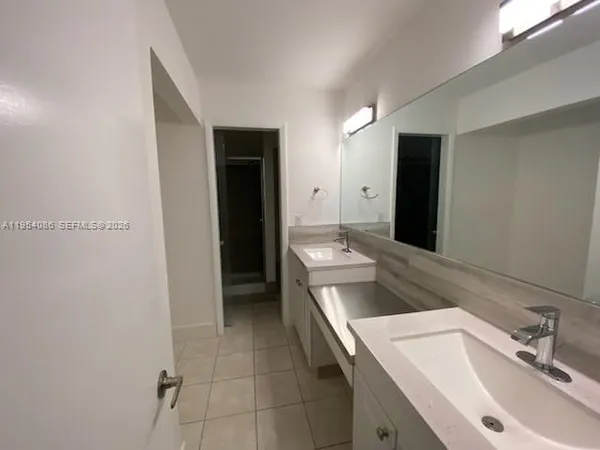 a bathroom with a sink and toilet