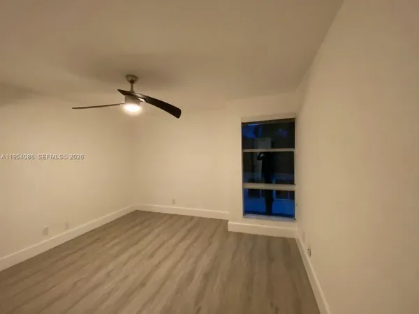 a bedroom with a bed and a table