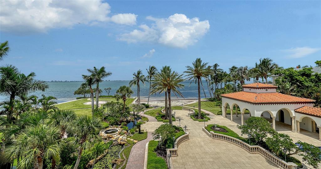 4423 Bay Shore Road Sarasota, FL 34234 - Photo 37 of 51 a view of a house with a yard and potted plants