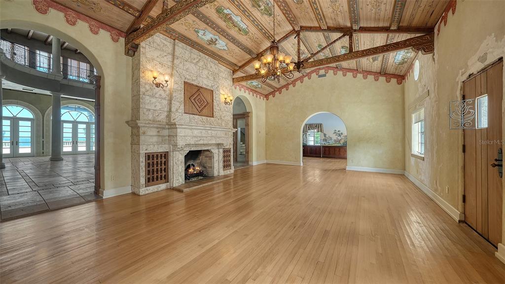 4423 Bay Shore Road Sarasota, FL 34234 - Photo 46 of 51 a view of a livingroom with wooden floor and a fireplace