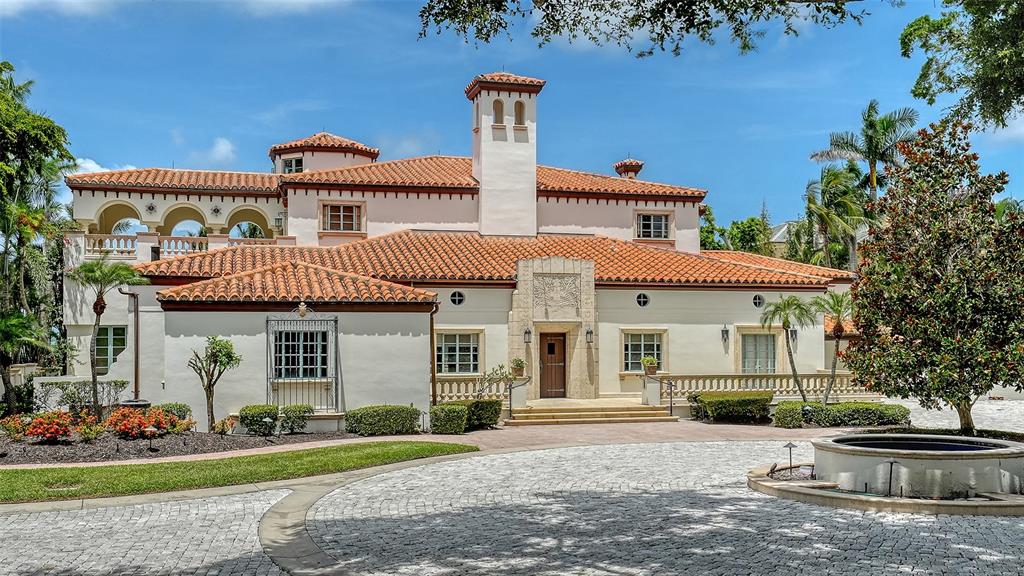 4423 Bay Shore Road Sarasota, FL 34234 - Photo 49 of 51 a front view of a house with a garden and plants