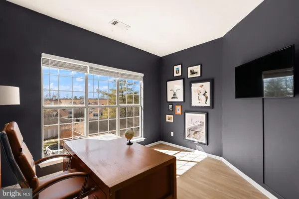 a view of a workspace with furniture