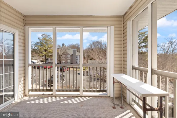 a view of a closet area with living room