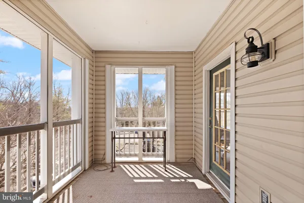 a view of a porch with a furniture