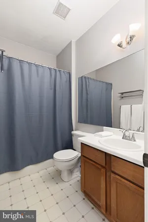 a building outdoor space with patio furniture and garden