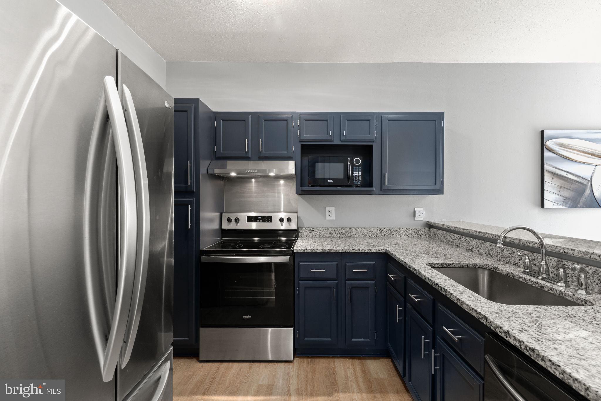 310 Canterbury Road Bel Air, MD 21014 - Photo 2 of 28 a kitchen with granite countertop a refrigerator stove and sink