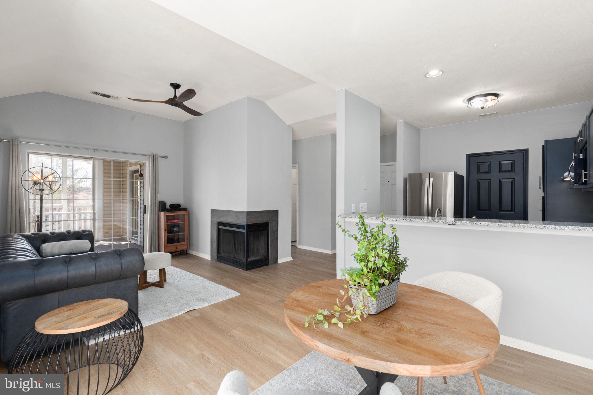 310 Canterbury Road Bel Air, MD 21014 - Photo 9 of 28 a living room with furniture potted plant and a fireplace