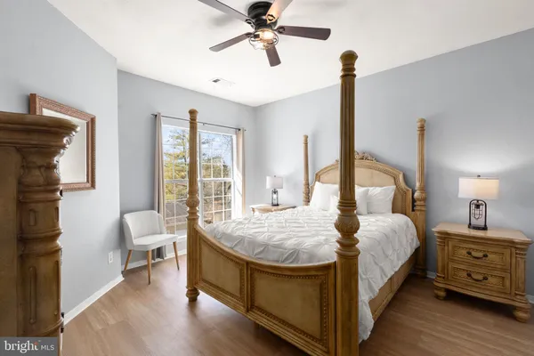 a bed room with a bed and a chandelier