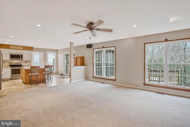 a view of a kitchen with furniture and a large window
