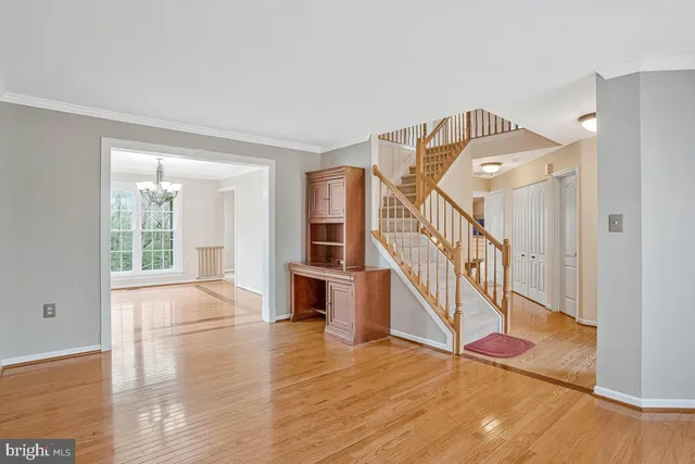 a view of an entryway with wooden floor