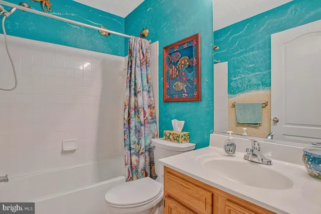 a view of a bedroom with a black and white checkered floor