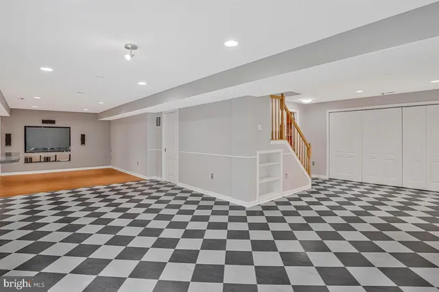 a view of an empty room with a fireplace and a window