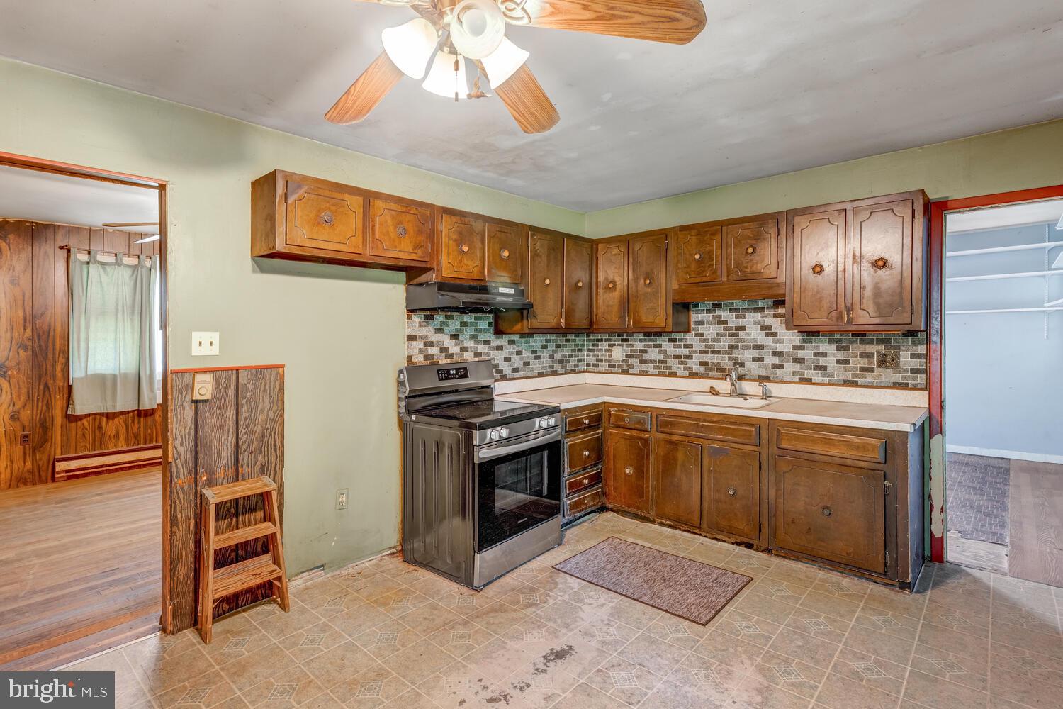 123 Jericho Road Tuckerton, NJ 08087 - Photo 12 of 29 a kitchen with stainless steel appliances granite countertop a stove refrigerator and cabinets