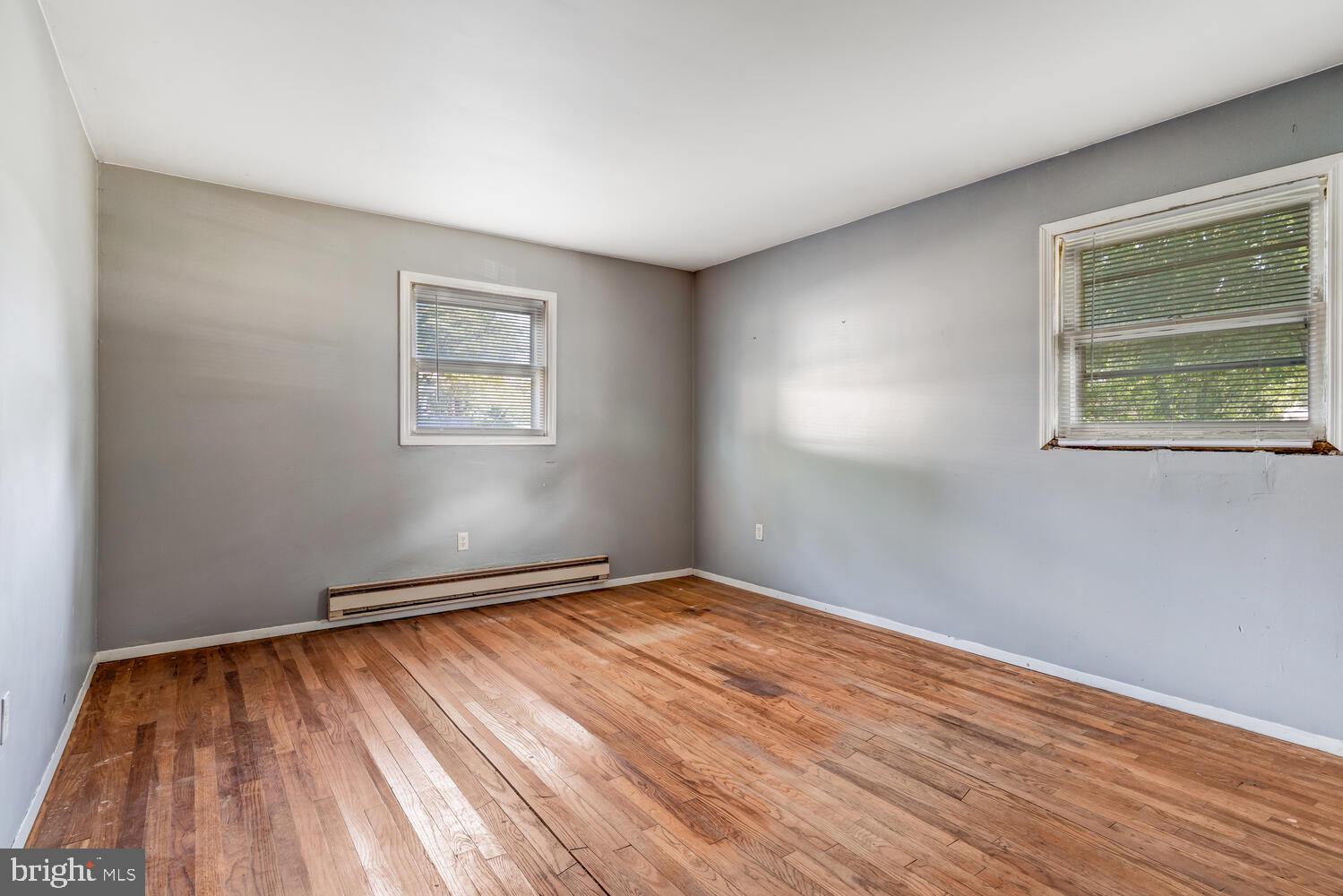 123 Jericho Road Tuckerton, NJ 08087 - Photo 14 of 29 a view of an empty room with wooden floor and a window