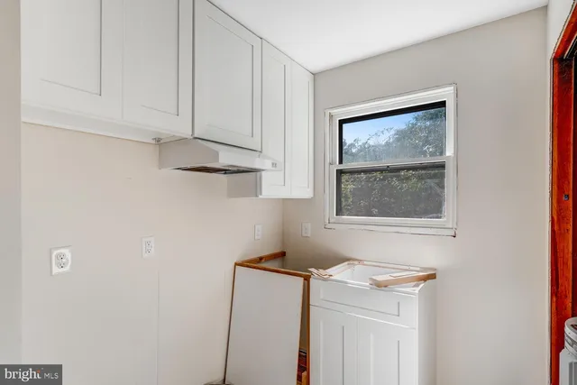 a kitchen with a cabinets and window