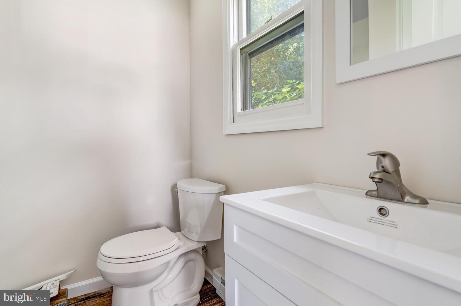 123 Jericho Road Tuckerton, NJ 08087 - Photo 28 of 29 a white toilet sitting next to a bathroom sink