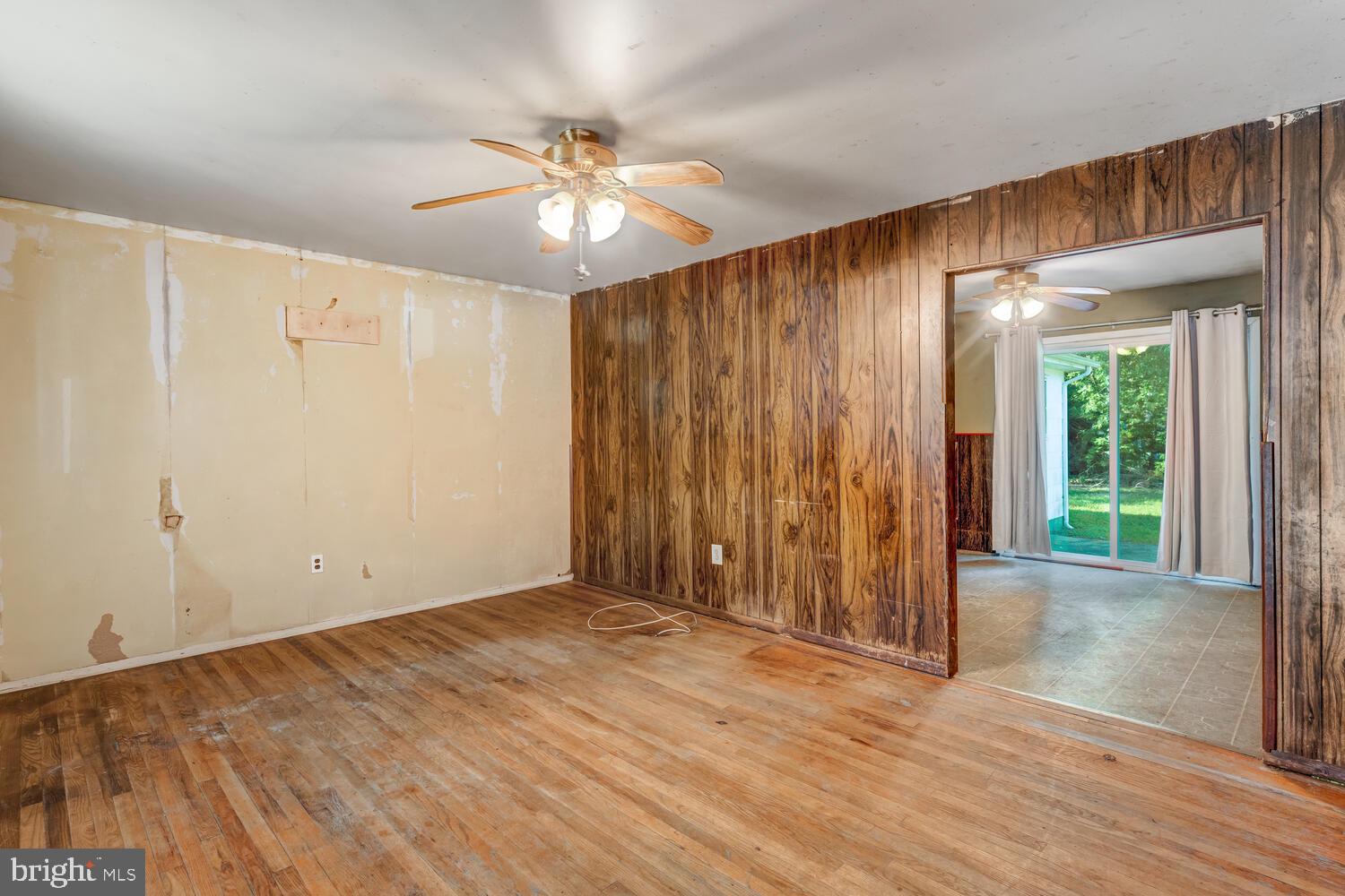 123 Jericho Road Tuckerton, NJ 08087 - Photo 7 of 29 wooden floor in an empty room with a window