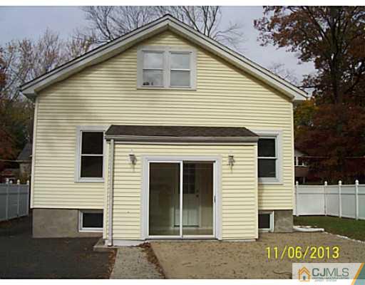 243 Walnut Street Dunellen, NJ 08812 - Photo 2 of 18 a view of a house with a yard