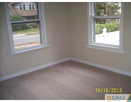 243 Walnut Street Dunellen, NJ 08812 - Photo 12 of 18 an empty room with a window