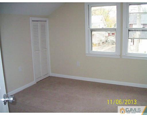 243 Walnut Street Dunellen, NJ 08812 - Photo 13 of 18 an empty room with a window