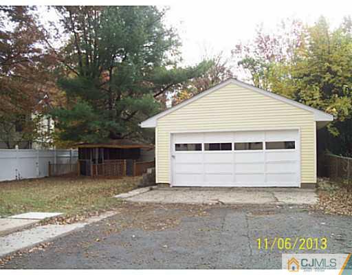 243 Walnut Street Dunellen, NJ 08812 - Photo 17 of 18 a view of a house with a yard