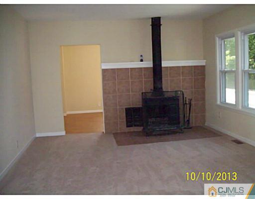 243 Walnut Street Dunellen, NJ 08812 - Photo 4 of 18 a view of a fireplace in the room