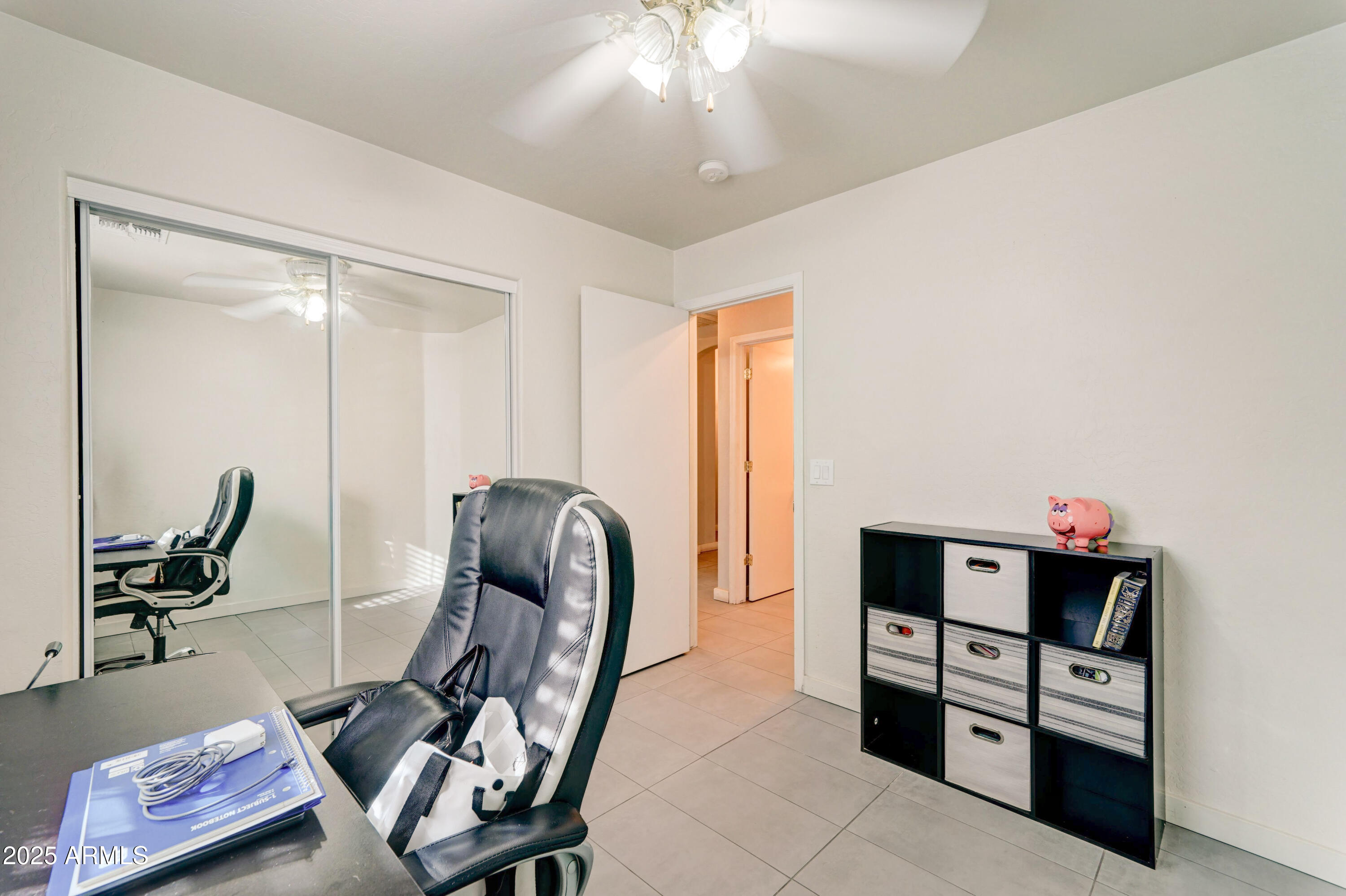 5515 South 15th Way Phoenix, AZ 85040 - Photo 19 of 26 a view of a workspace with furniture and gym equipment