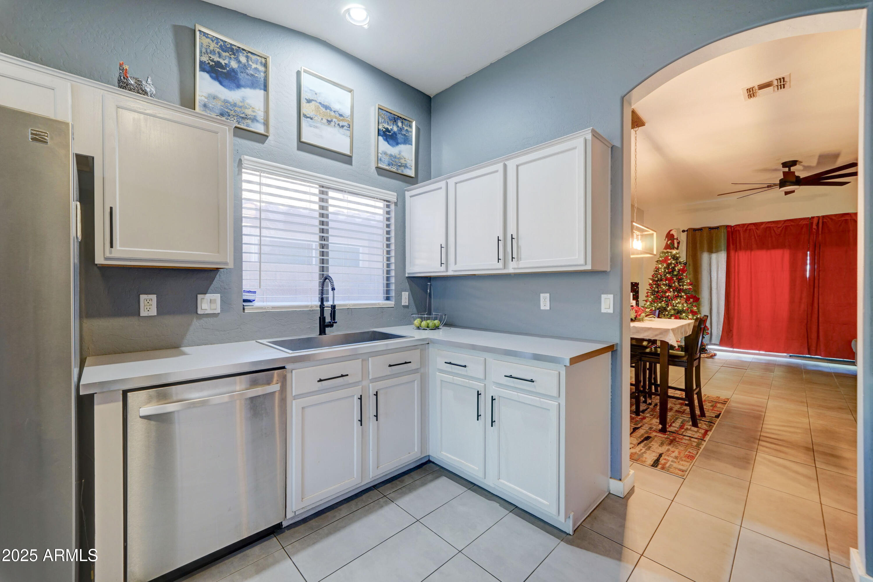 5515 South 15th Way Phoenix, AZ 85040 - Photo 9 of 26 a kitchen with cabinets and chairs