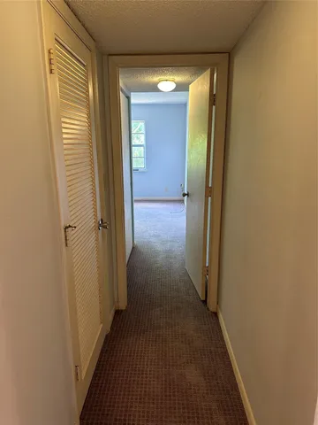 a view of a bathroom from a hallway