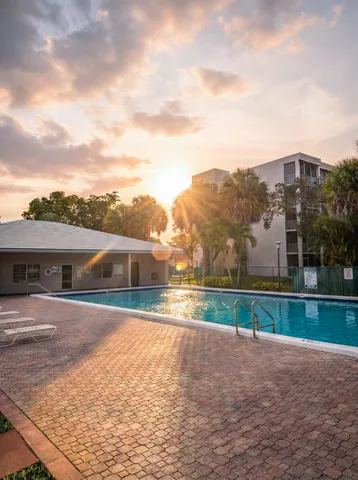 a view of house with a yard